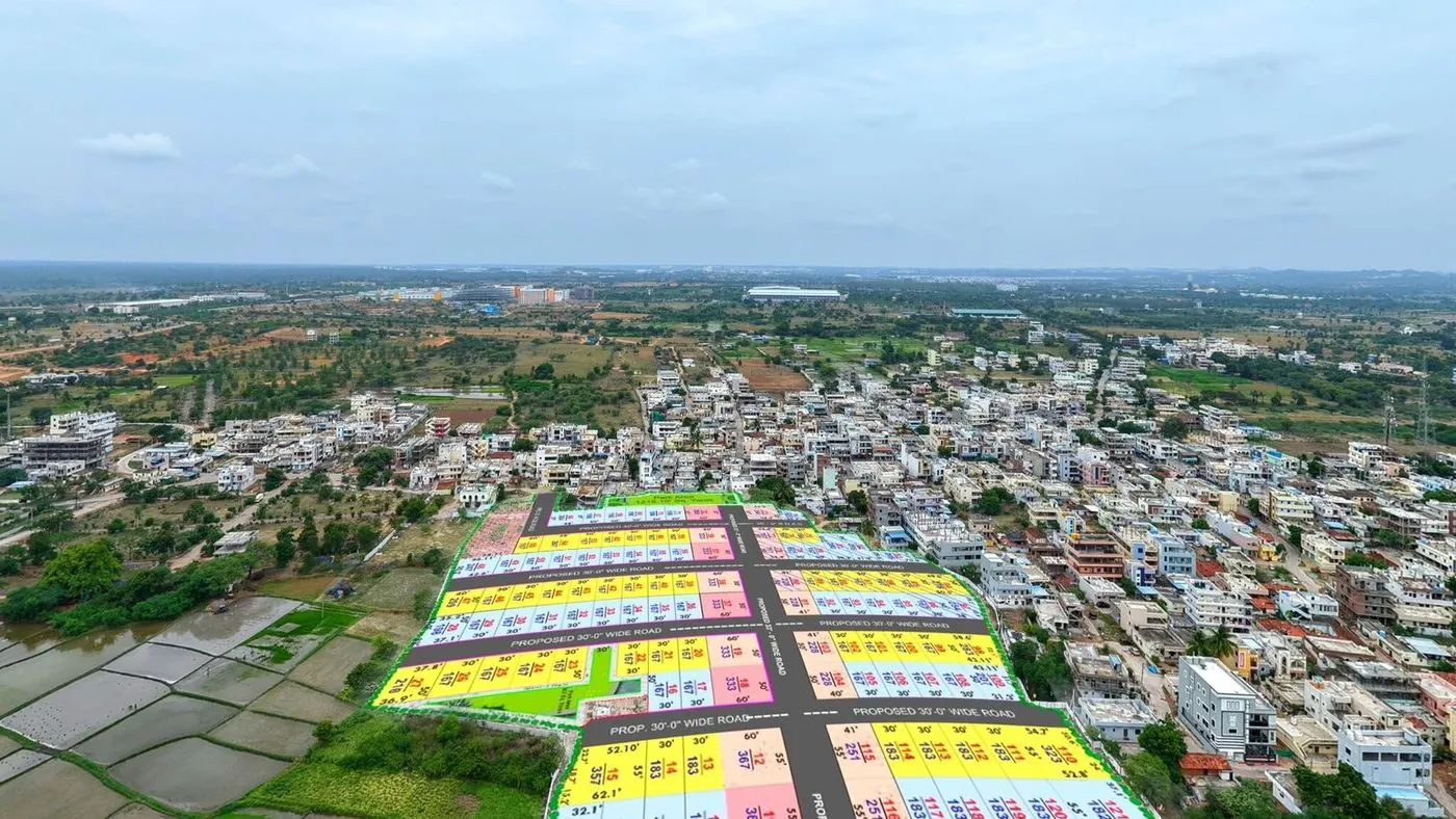 Industrial sheds and warehouses on the Adibatla corridor near the project